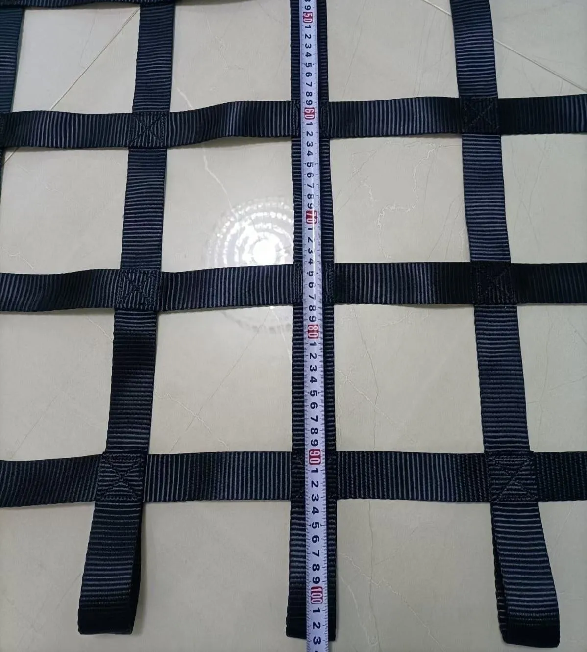 Black polyester ribbon children's climbing net with 1.5 inch wide straps and 5 inch mesh openings