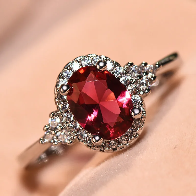 Adjustable open mouth copper ring with oval ruby stone in white gold colour