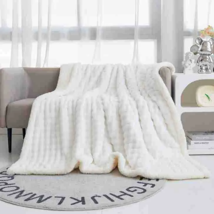 Bubble double layer thick lambskin blanket in beige on a sofa