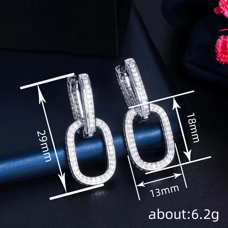 Pair of copper earrings with inlaid zircon, U-shaped geometric buckle design in white gold colour