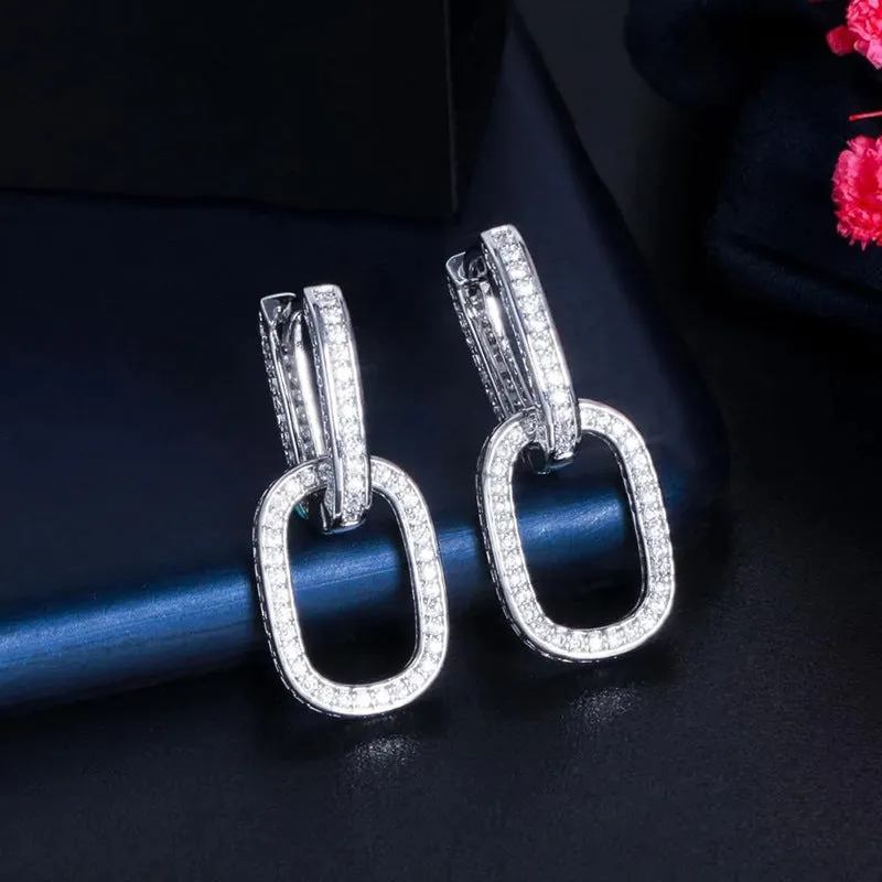 Pair of copper earrings with inlaid zircon, U-shaped geometric buckle design in white gold colour