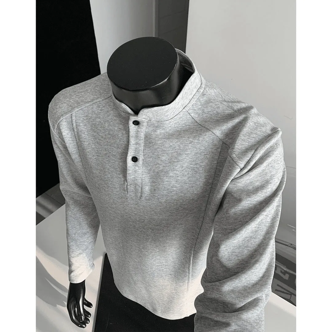 Men's grey asymmetric polo shirt with a patchwork stand-up collar and long sleeves.