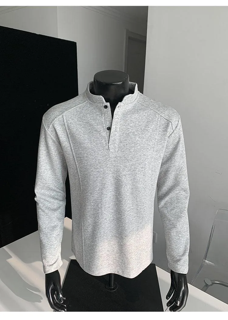 Men's grey asymmetric polo shirt with a patchwork stand-up collar and long sleeves.