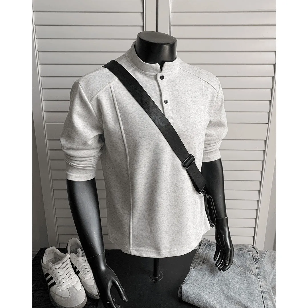 Men's grey asymmetric polo shirt with a patchwork stand-up collar and long sleeves.