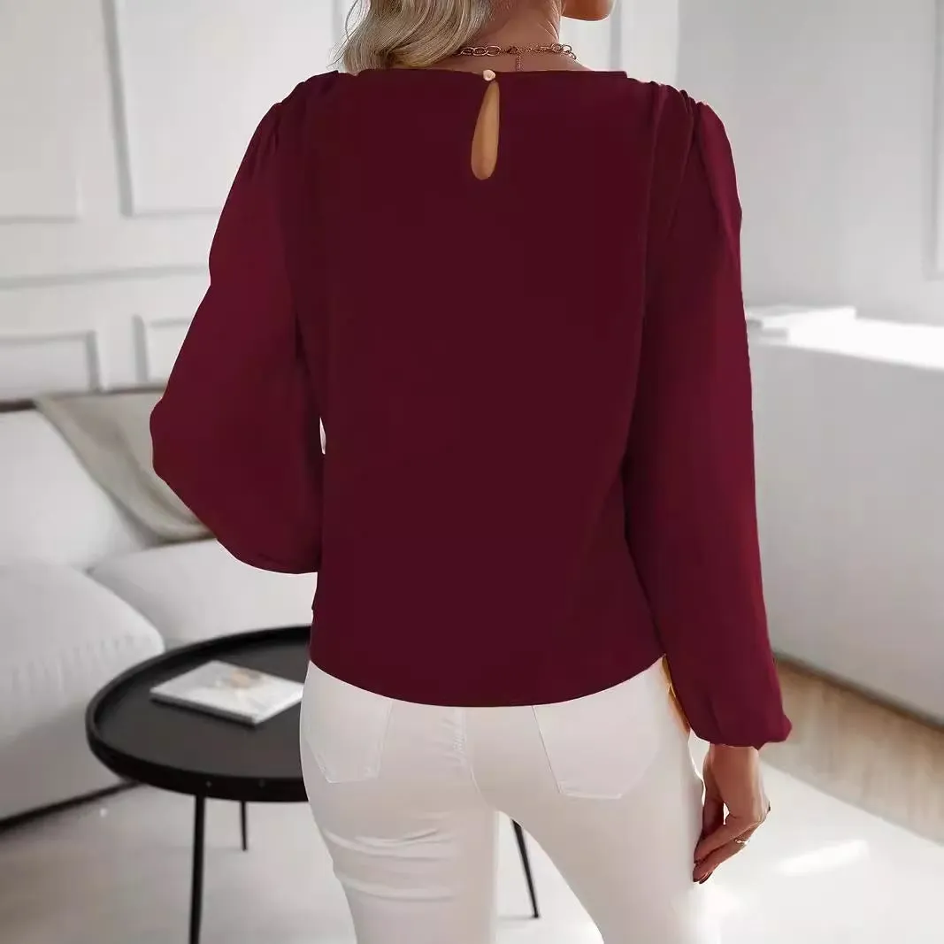Wine red women's solid colour round neck long sleeve polyester top with button front, shown on a model.