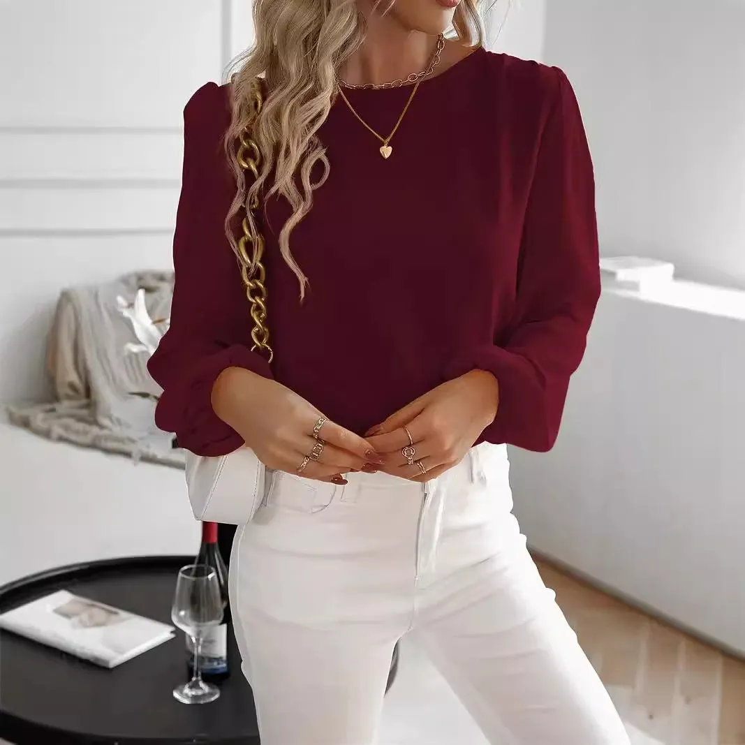Wine red women's solid colour round neck long sleeve polyester top with button front, shown on a model.