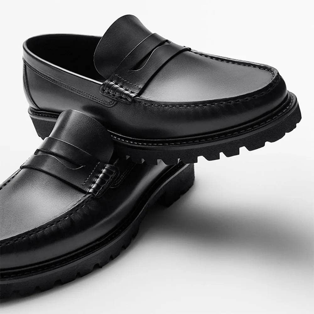 Men's brown leather loafers with first layer cowhide upper, rubber sole, and low heel on a neutral background