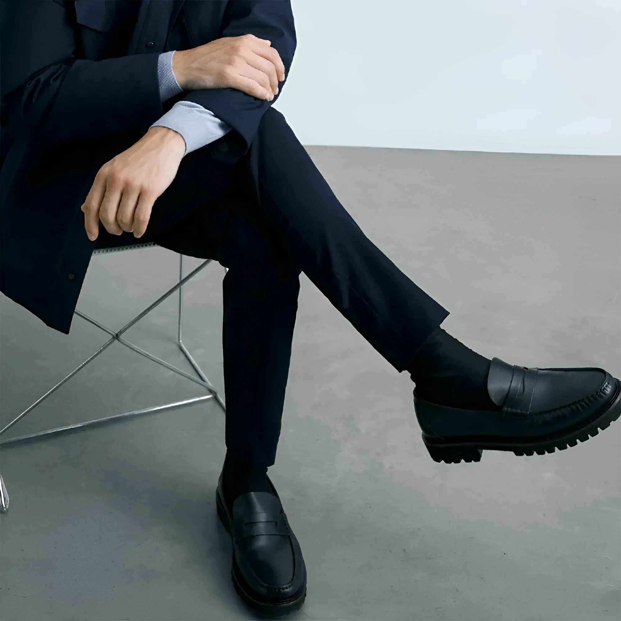 Men's brown leather loafers with first layer cowhide upper, rubber sole, and low heel on a neutral background