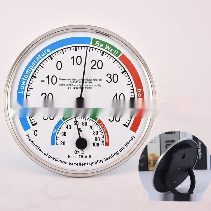 Indoor wall thermometer with plastic black shell and black plastic pointer on a wall
