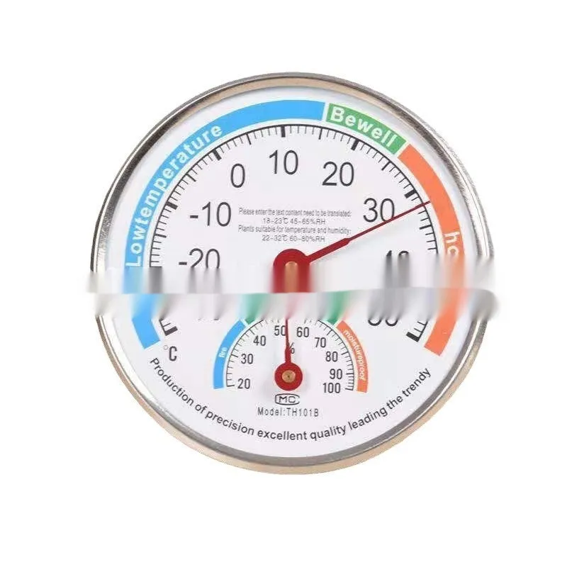Indoor wall thermometer with plastic black shell and black plastic pointer on a wall