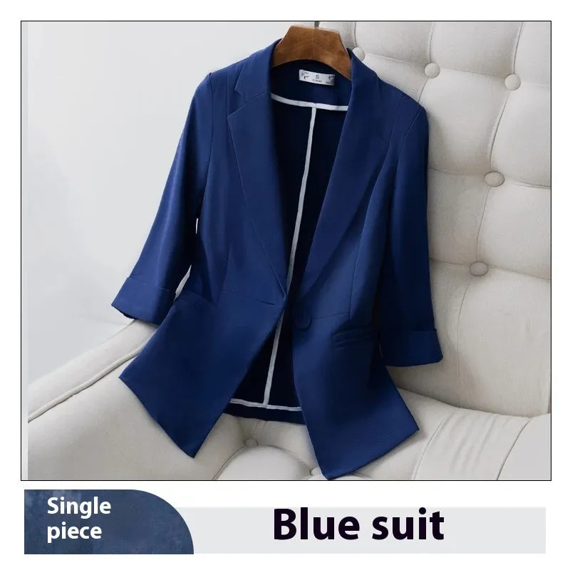 Blue polyester formal suit set with long sleeve jacket and cropped pants on a model