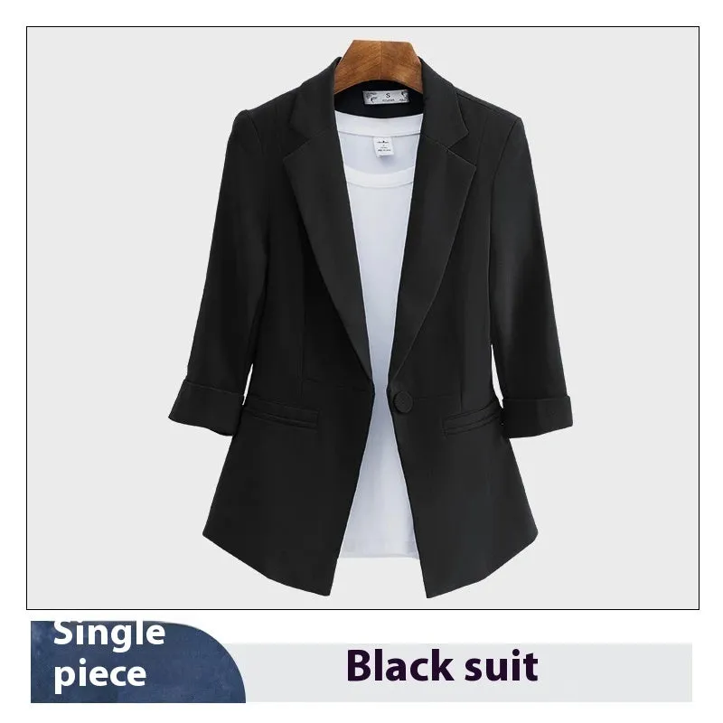 Blue polyester formal suit set with long sleeve jacket and cropped pants on a model