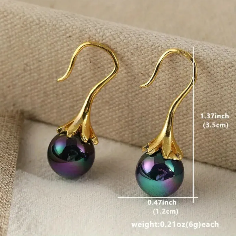 A pair of gold-coloured retro fashion alloy earrings for women with an electroplated finish.