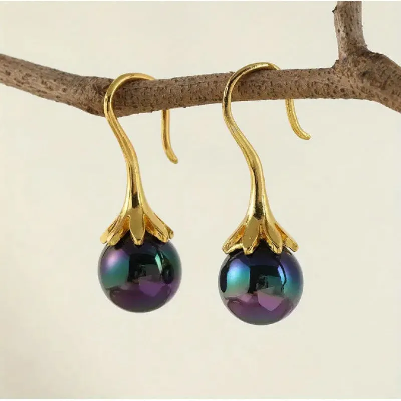 A pair of gold-coloured retro fashion alloy earrings for women with an electroplated finish.