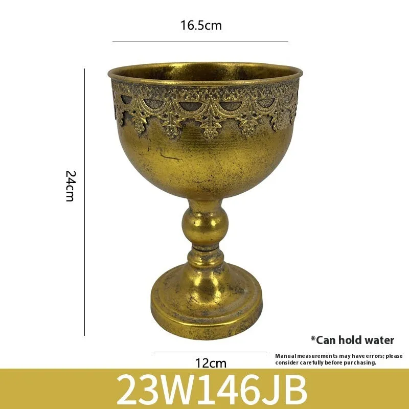 Metal decorative vase with black and gold finish, modern simplicity design on a tabletop