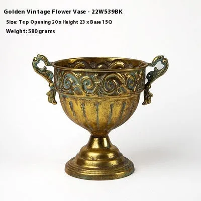 Metal decorative vase with black and gold finish, modern simplicity design on a tabletop