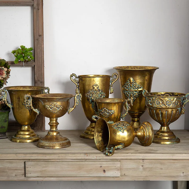Metal decorative vase with black and gold finish, modern simplicity design on a tabletop