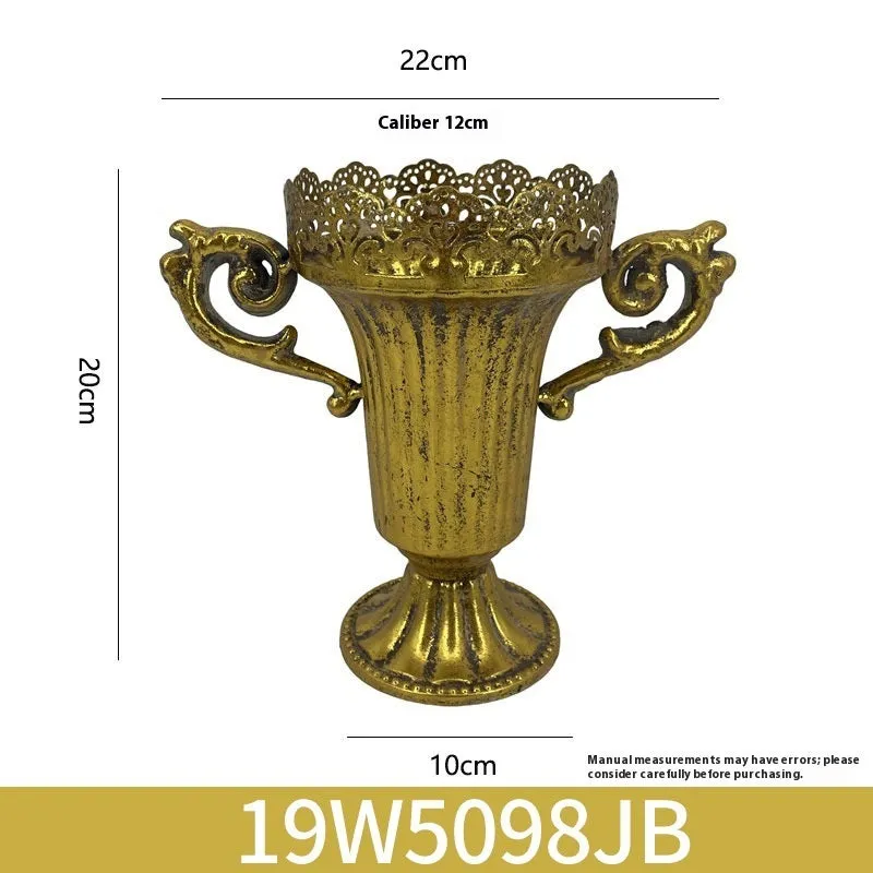 Metal decorative vase with black and gold finish, modern simplicity design on a tabletop