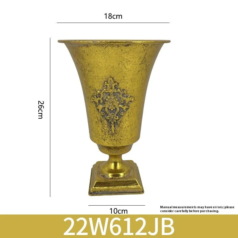 Metal decorative vase with black and gold finish, modern simplicity design on a tabletop
