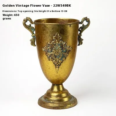 Metal decorative vase with black and gold finish, modern simplicity design on a tabletop