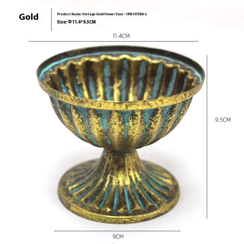 Metal decorative vase with black and gold finish, modern simplicity design on a tabletop