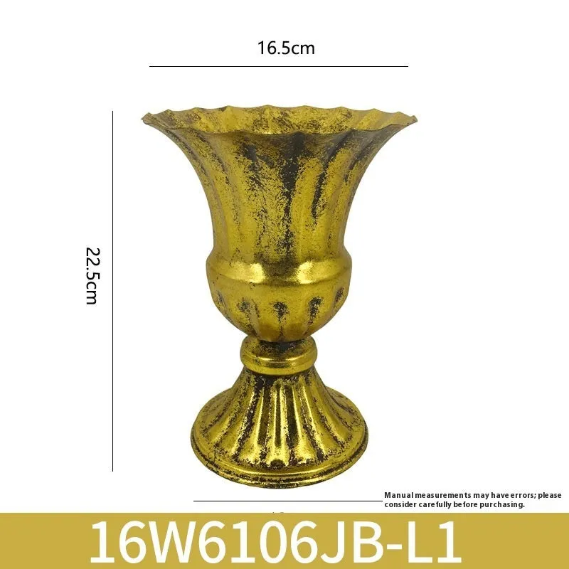 Metal decorative vase with black and gold finish, modern simplicity design on a tabletop