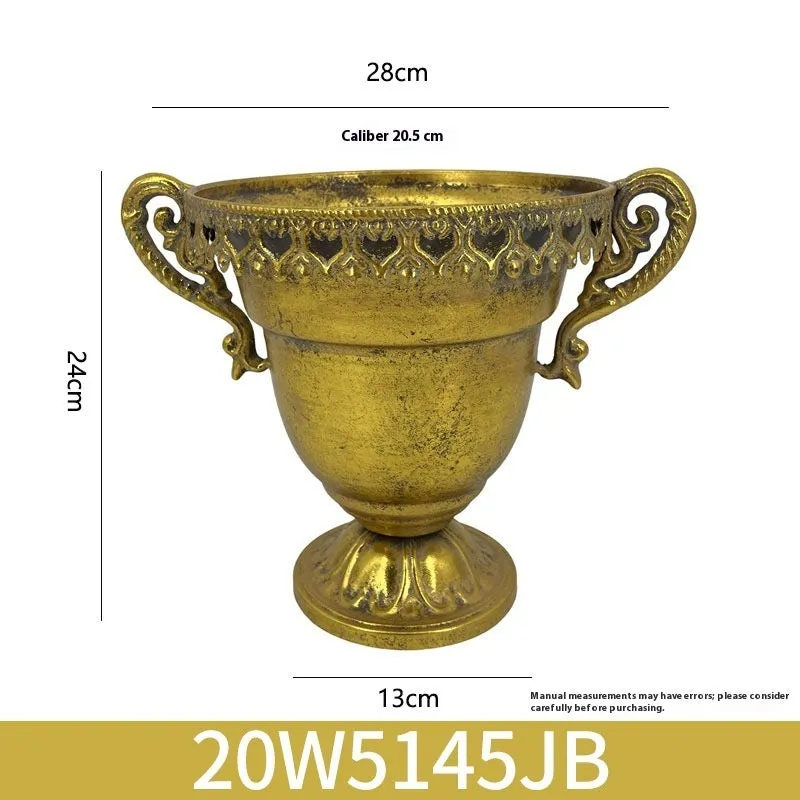 Metal decorative vase with black and gold finish, modern simplicity design on a tabletop