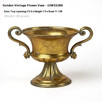 Metal decorative vase with black and gold finish, modern simplicity design on a tabletop