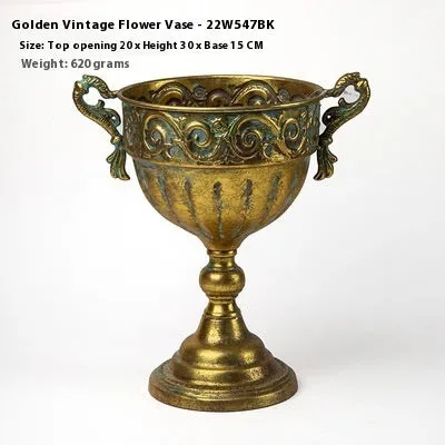 Metal decorative vase with black and gold finish, modern simplicity design on a tabletop