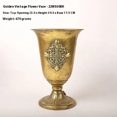 Metal decorative vase with black and gold finish, modern simplicity design on a tabletop
