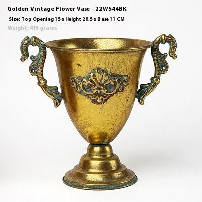 Metal decorative vase with black and gold finish, modern simplicity design on a tabletop