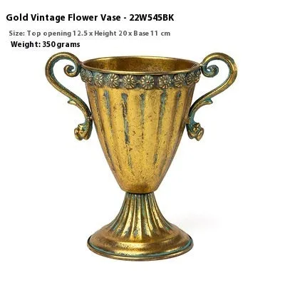 Metal decorative vase with black and gold finish, modern simplicity design on a tabletop