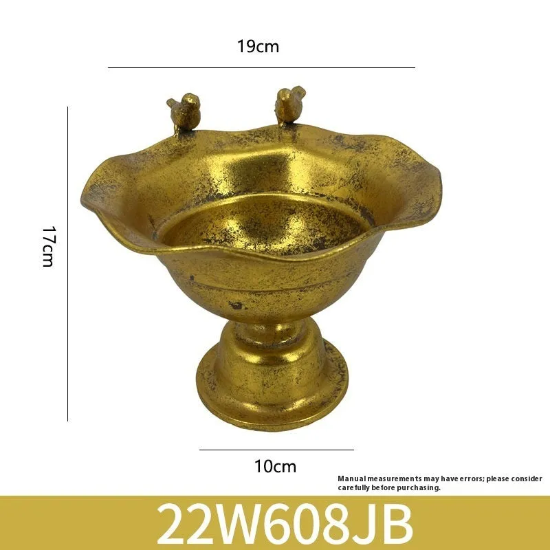Metal decorative vase with black and gold finish, modern simplicity design on a tabletop