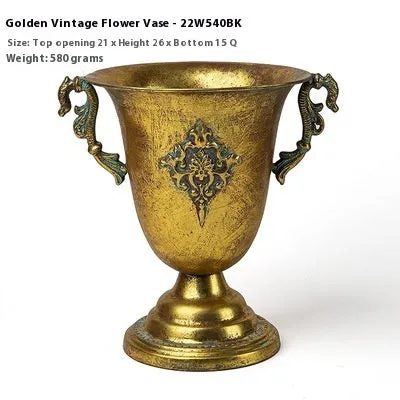 Metal decorative vase with black and gold finish, modern simplicity design on a tabletop