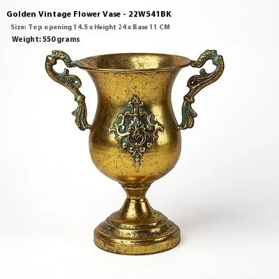 Metal decorative vase with black and gold finish, modern simplicity design on a tabletop