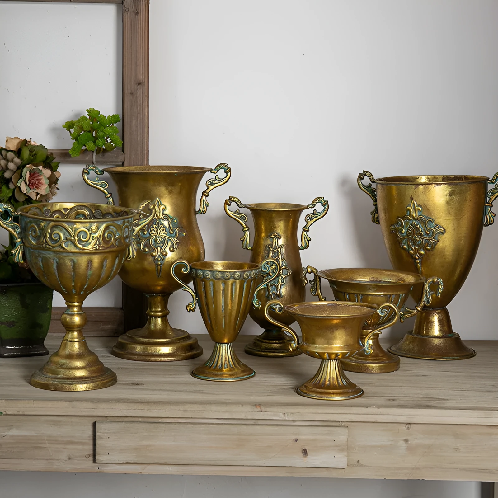 Metal decorative vase with black and gold finish, modern simplicity design on a tabletop