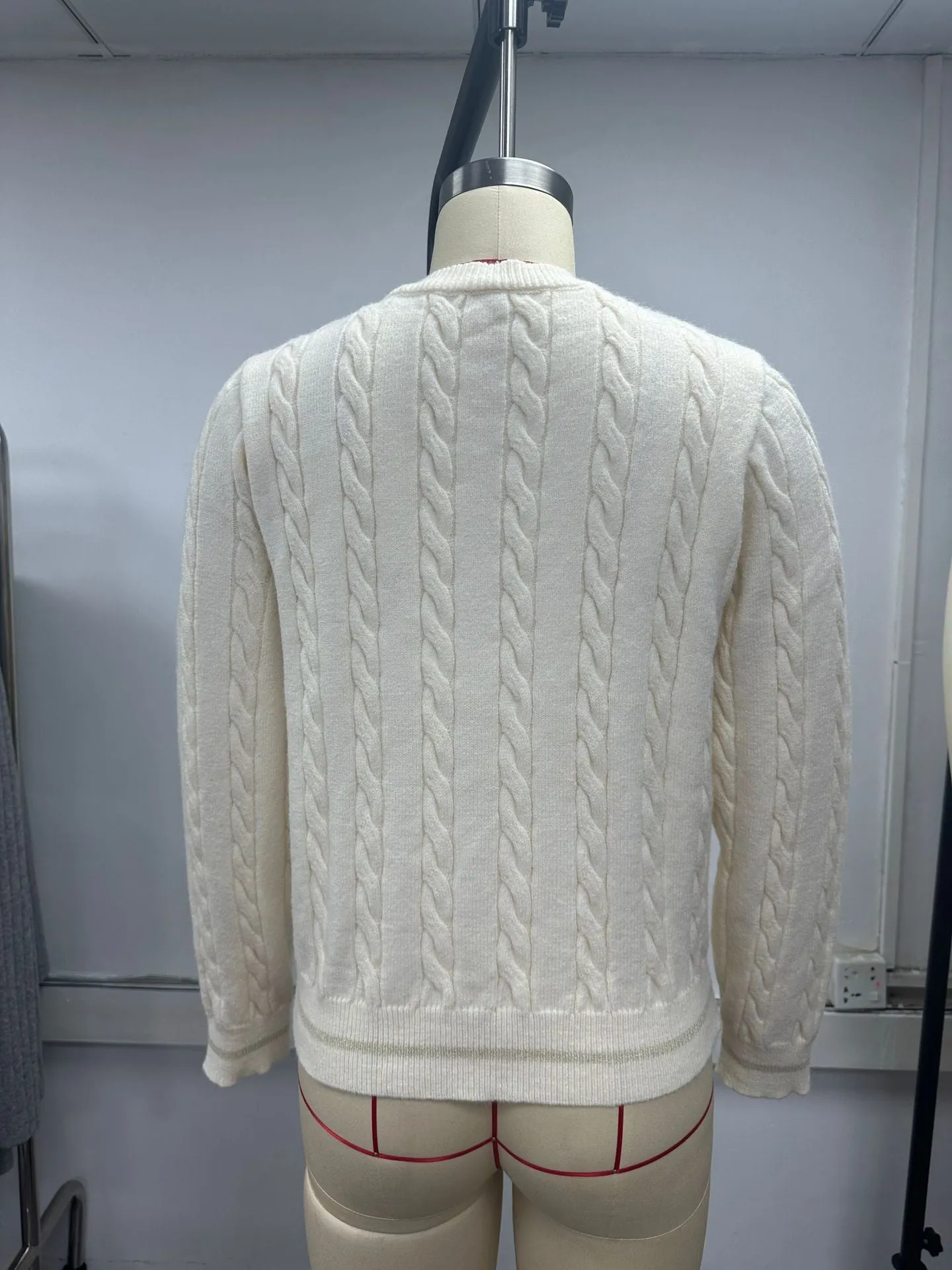 Women's champagne round neck twisted knitted sweater coat cardigan with long sleeves, on a plain background