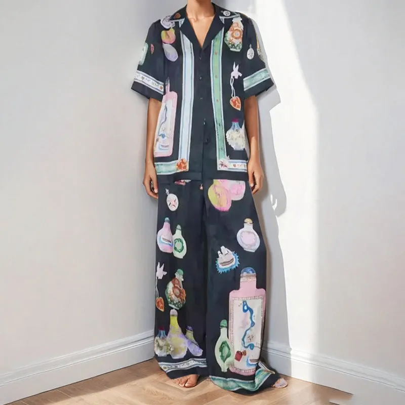 Black women's casual set with cartoon print, featuring a cardigan and matching trousers