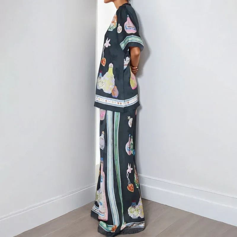 Black women's casual set with cartoon print, featuring a cardigan and matching trousers
