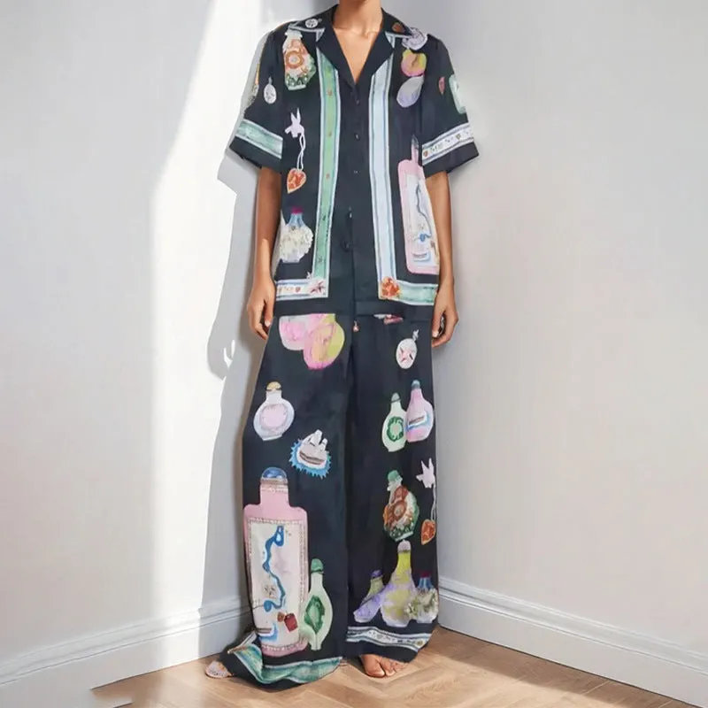 Black women's casual set with cartoon print, featuring a cardigan and matching trousers