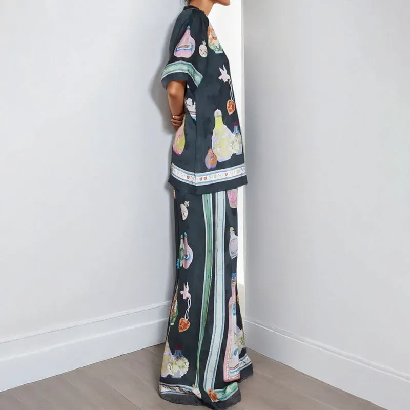 Black women's casual set with cartoon print, featuring a cardigan and matching trousers