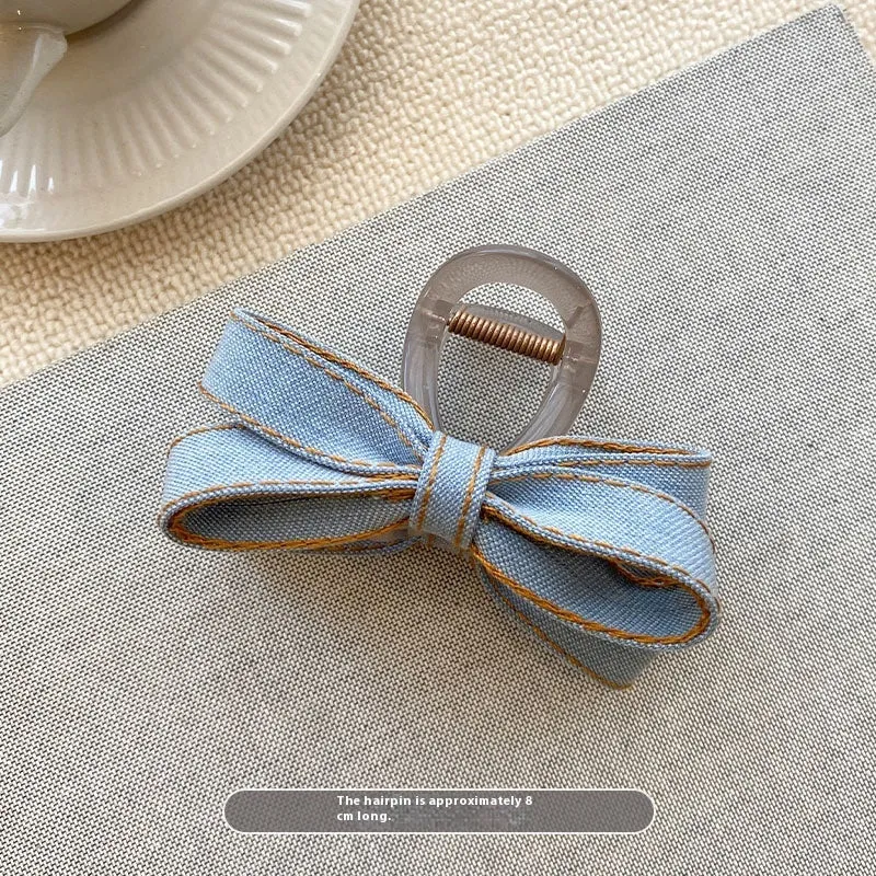 Blue denim bow barrette with cloth bow and metal clip on women back head hair