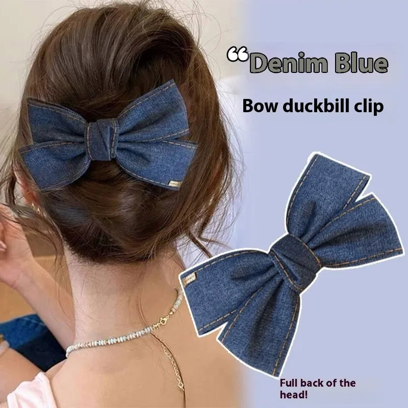 Blue denim bow barrette with cloth bow and metal clip on women back head hair
