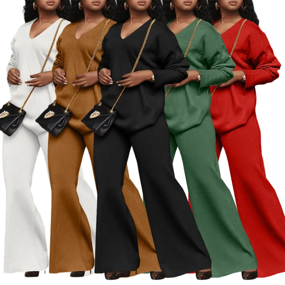 Women's brown thickened velvet two-piece suit with split sleeve top and trousers on a hanger.