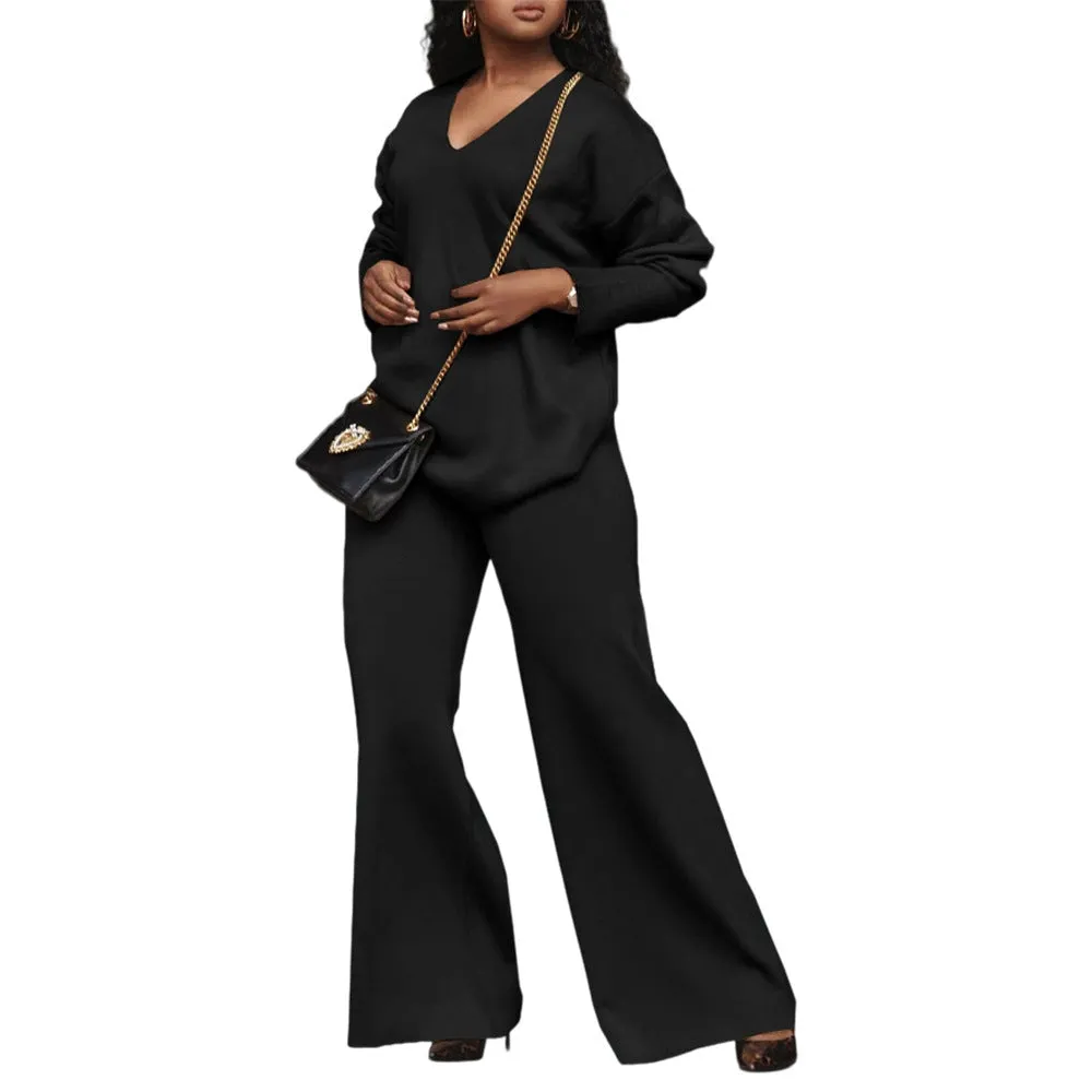 Women's brown thickened velvet two-piece suit with split sleeve top and trousers on a hanger.
