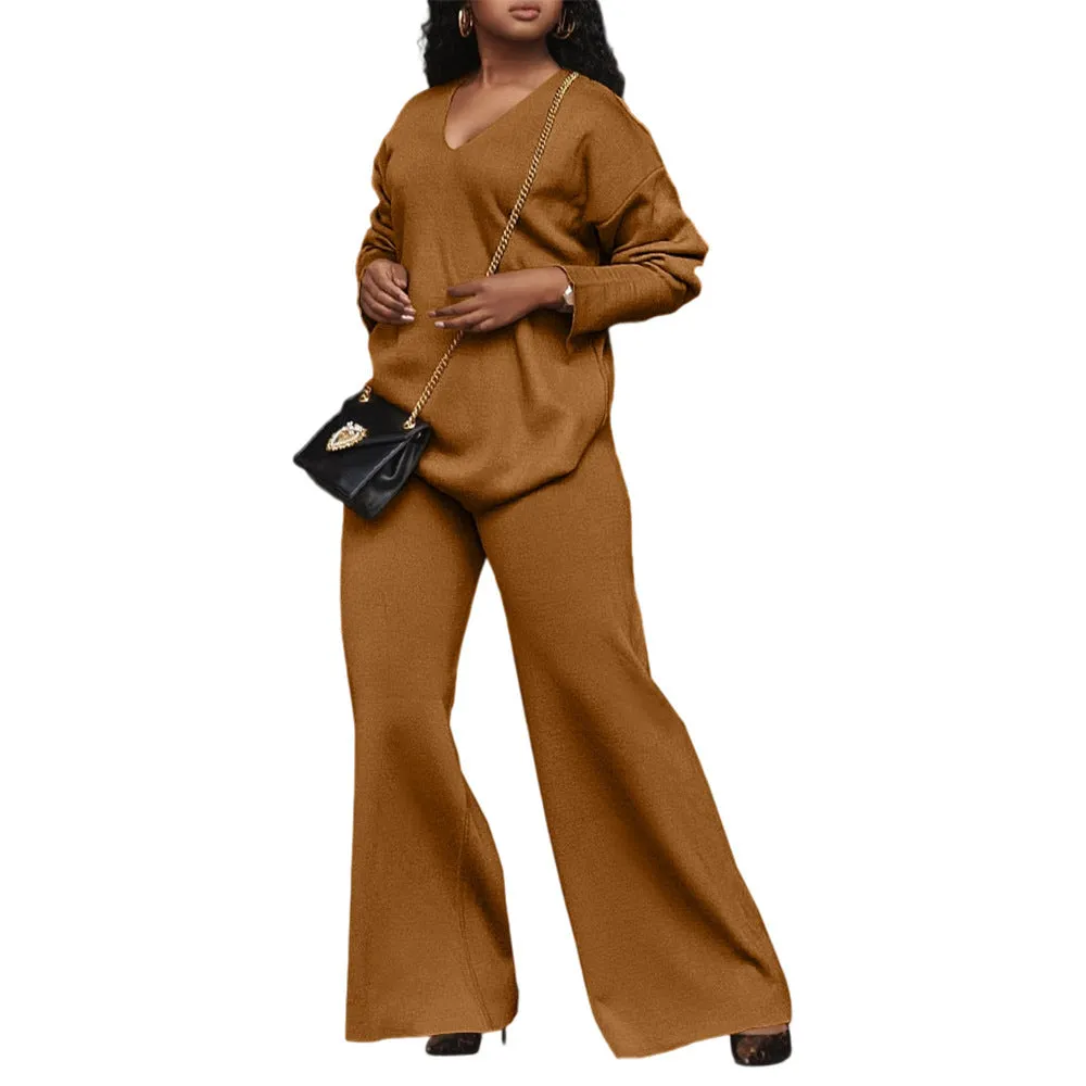 Women's brown thickened velvet two-piece suit with split sleeve top and trousers on a hanger.