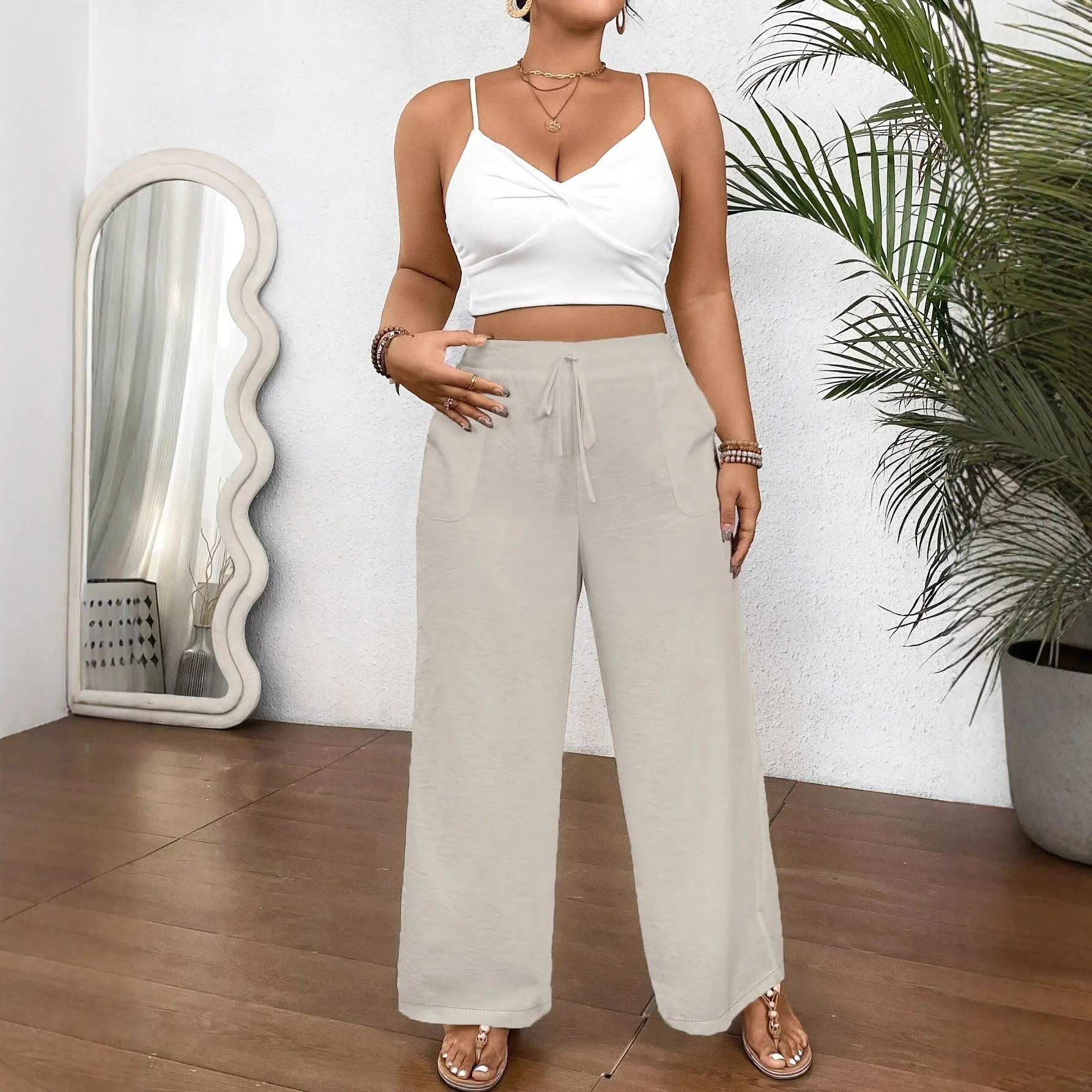Women's drawstring wide leg polyester trousers in khaki with side pockets and loose fit