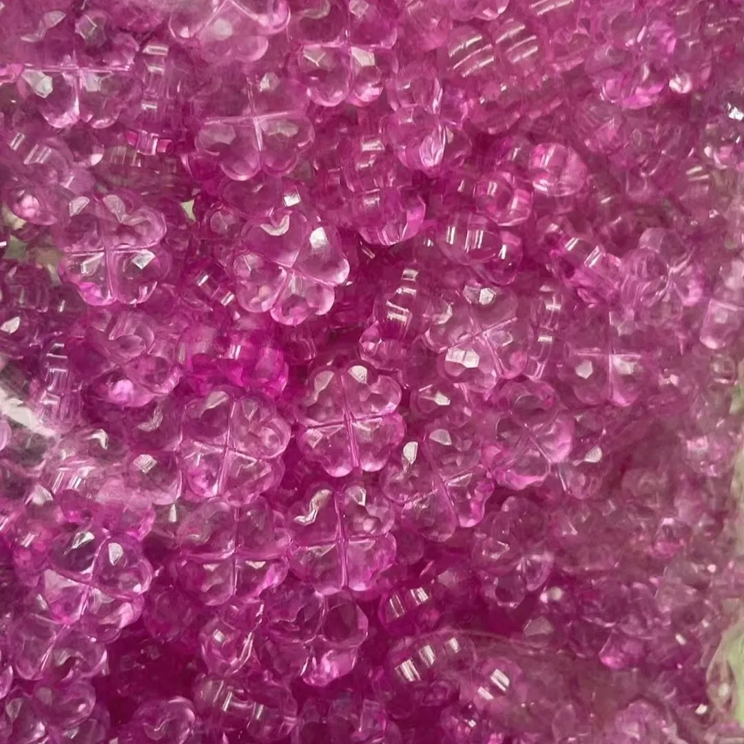 High transparency acrylic fat clover camellia beads scattered on white surface