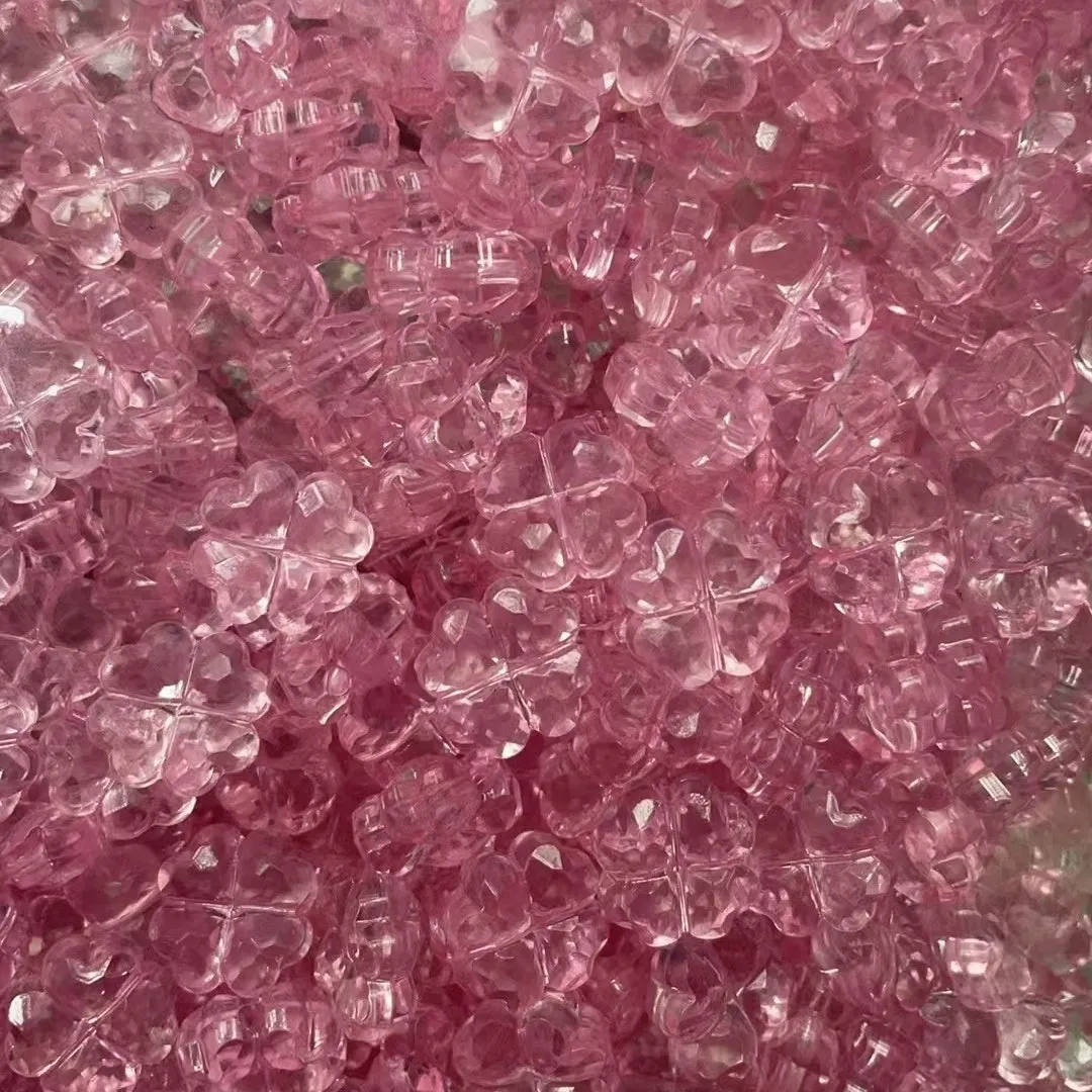 High transparency acrylic fat clover camellia beads scattered on white surface