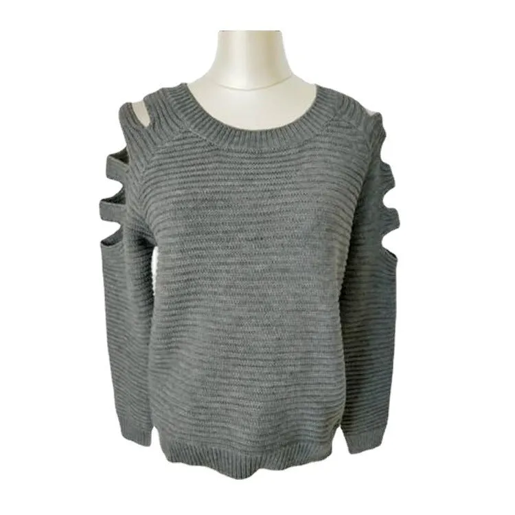 White women's hollow-out knitted long sleeve shirt with round neck on a hanger.